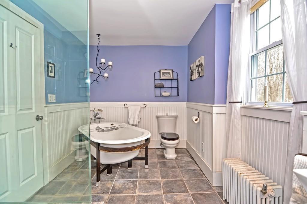 50 Warren Road Brimfield, MA 01010 - Photo 38 of 42 a bathroom with a sink a mirror and a toilet