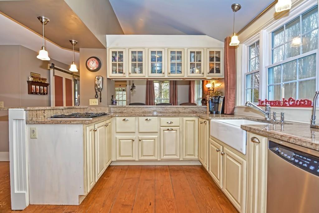 50 Warren Road Brimfield, MA 01010 - Photo 8 of 42 a kitchen with granite countertop a sink and cabinets