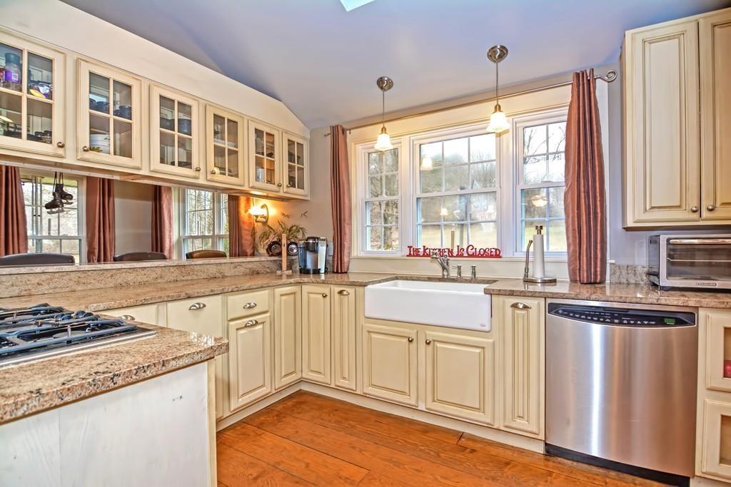 50 Warren Road Brimfield, MA 01010 - Photo 9 of 42 a kitchen with stainless steel appliances granite countertop a stove and a sink