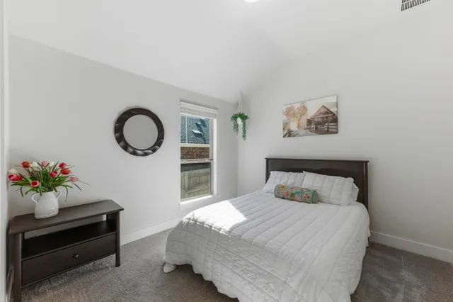 a bathroom with a double vanity sink toilet and shower