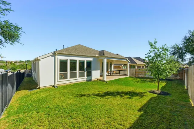 a backyard of a house with lots of green space