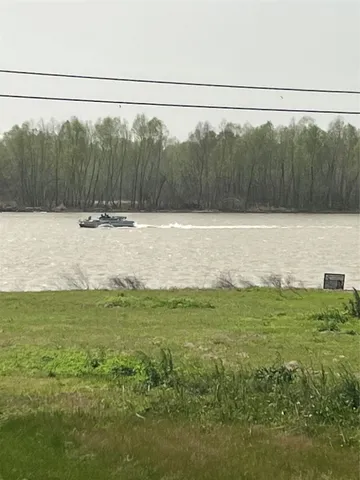 a view of a field with a fence