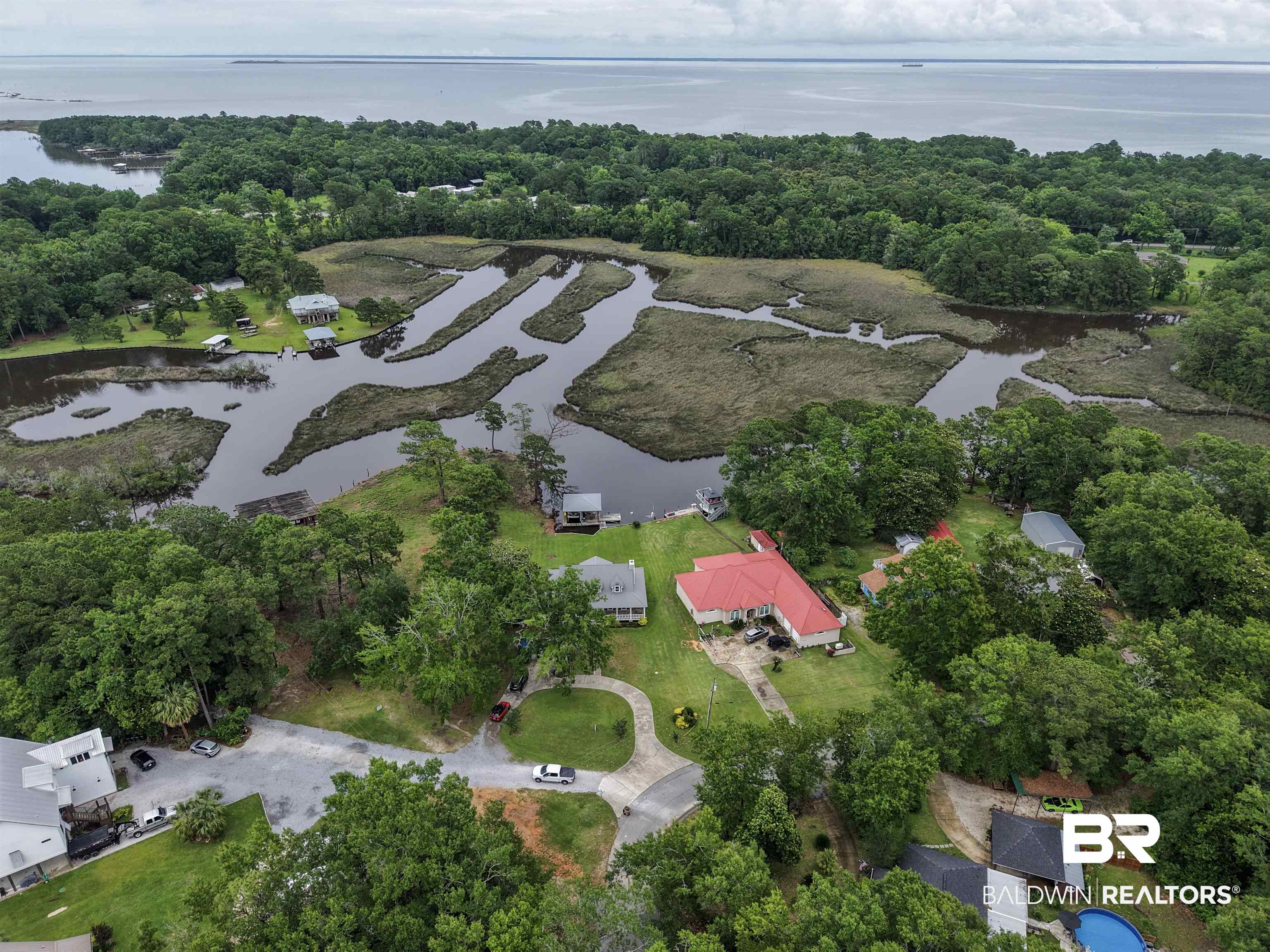 12171 Marguerite Drive Coden, AL 36523 - Photo 27 of 44 Aerial perspective showcasing extensive waterfrontage and lush, mature tree coverage