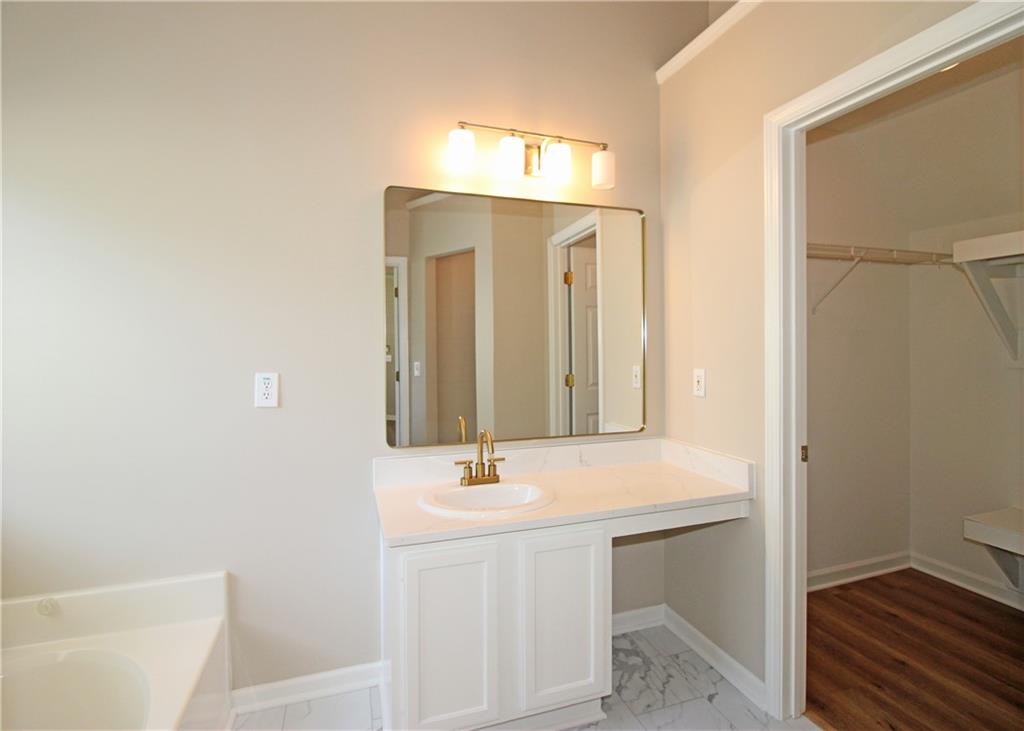 1334 Ambercrest Way Austell, GA 30168 - Photo 13 of 20 a bathroom with a sink a toilet and shower