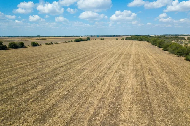 a view of an ocean beach and mountain