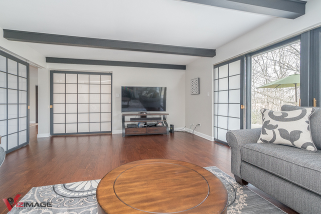 44 Old Creek Road Palos Park, IL 60464 - Photo 12 of 38 a living room with furniture and a flat screen tv
