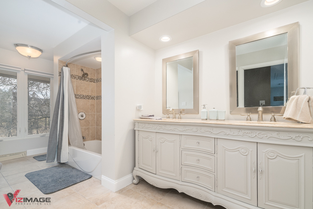 44 Old Creek Road Palos Park, IL 60464 - Photo 16 of 38 a bathroom with a sink and a mirror