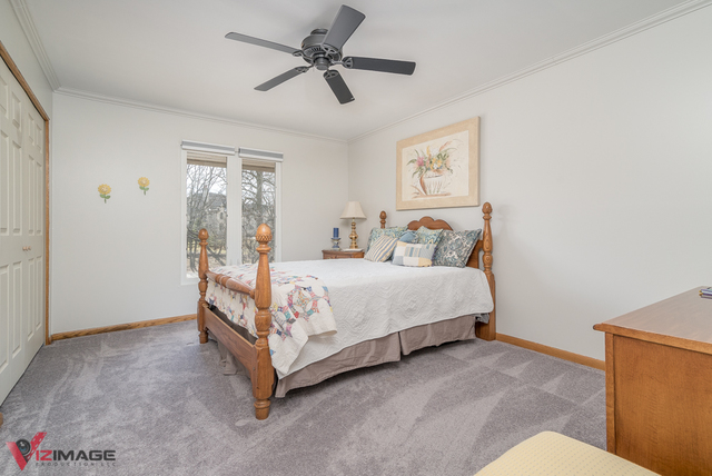 44 Old Creek Road Palos Park, IL 60464 - Photo 18 of 38 a bedroom with a bed mirror and a window