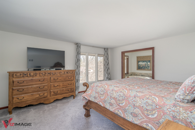 44 Old Creek Road Palos Park, IL 60464 - Photo 21 of 38 a bedroom with a bed and flat screen tv