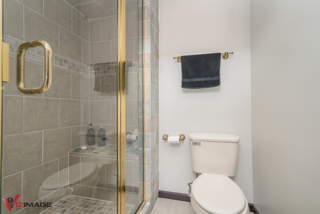 44 Old Creek Road Palos Park, IL 60464 - Photo 23 of 38 a bathroom with a toilet and a shower