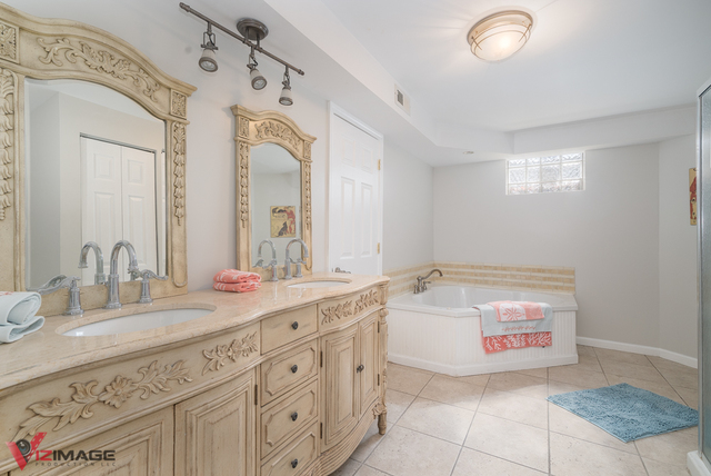 44 Old Creek Road Palos Park, IL 60464 - Photo 26 of 38 a bathroom with a sink double vanity sink and a mirror