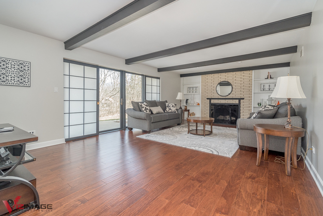 44 Old Creek Road Palos Park, IL 60464 - Photo 4 of 38 a living room with furniture and a fireplace