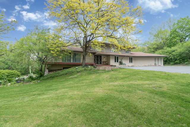 44 Old Creek Road Palos Park, IL 60464 - Photo 36 of 38 a front view of a house with a garden