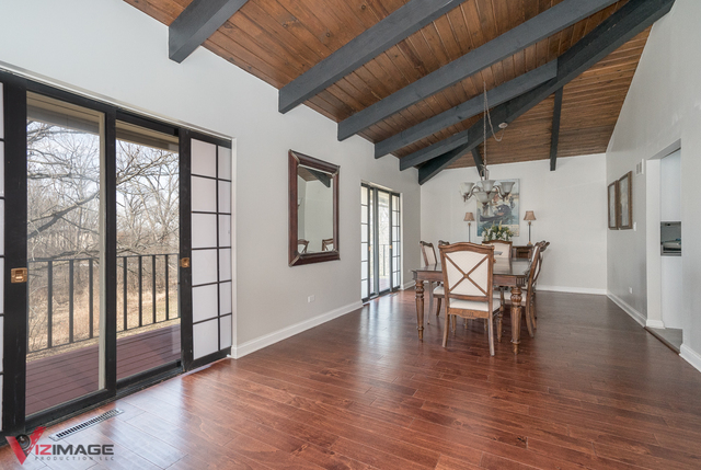 44 Old Creek Road Palos Park, IL 60464 - Photo 6 of 38 a view of a dining room with furniture window and wooden floor