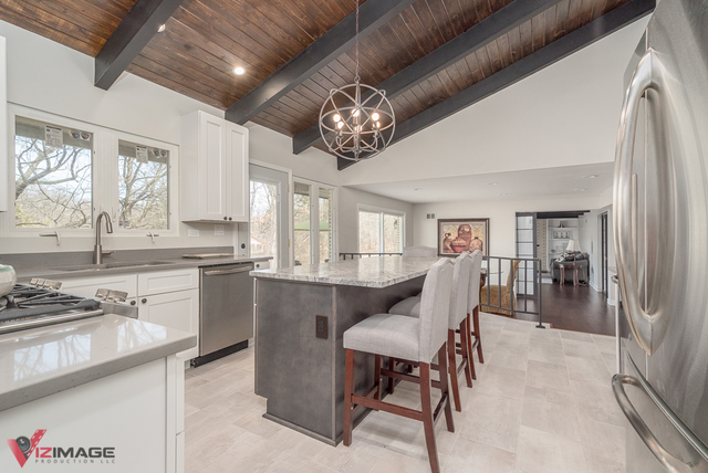 44 Old Creek Road Palos Park, IL 60464 - Photo 10 of 38 a view of a dining room with furniture a chandelier and wooden floor