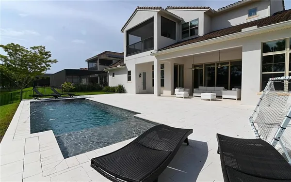 a view of a patio with a table and chairs