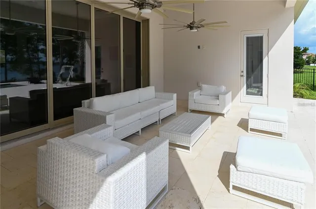 a bathroom with a granite countertop sink a toilet and a mirror