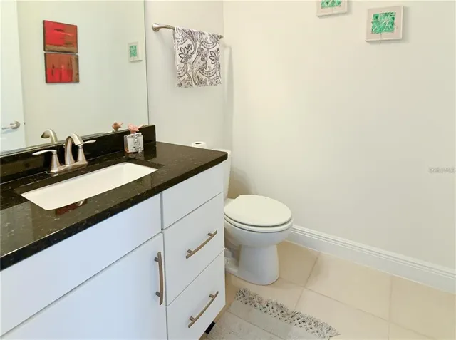 a living room with furniture a window and a flat screen tv