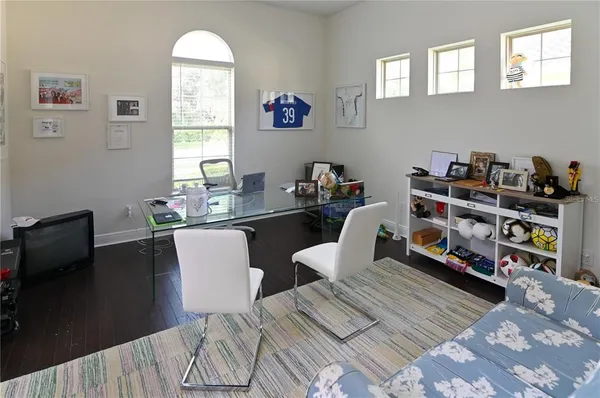 a room with gym equipment and windows