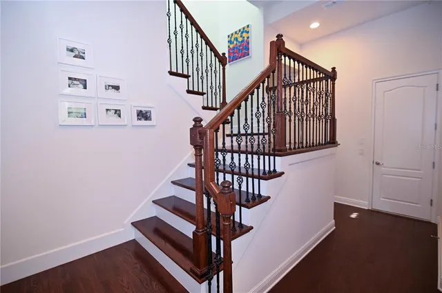 a bathroom with a tub a double vanity sink and mirror