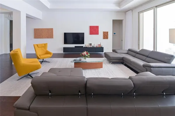 a living room with furniture and a couch