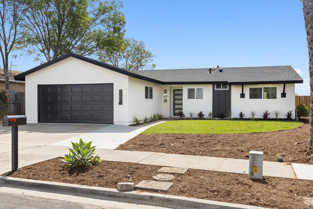 4907 Stephanie Place Oceanside, CA 92057 - Photo 1 of 24 a front view of house with yard