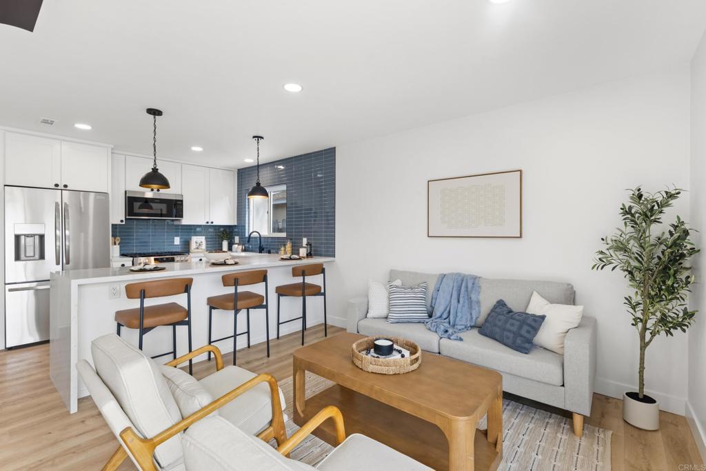 4907 Stephanie Place Oceanside, CA 92057 - Photo 11 of 24 a living room with furniture kitchen and a table
