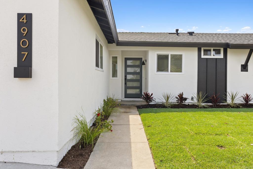 4907 Stephanie Place Oceanside, CA 92057 - Photo 2 of 24 a front view of house with yard