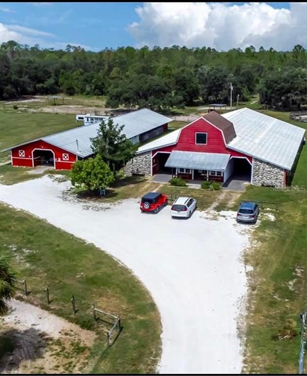 Butch Cassidy Trail Wimauma, FL 33598 - Photo 16 of 22 an aerial view of a house with a yard