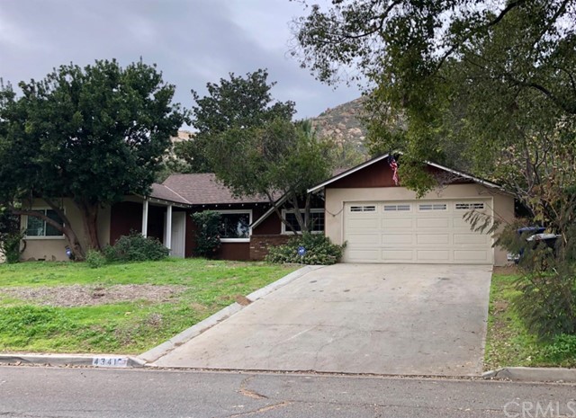 4341 Isabella Street Riverside, CA 92501 - Photo 1 of 1 a white house that has a tree in front of it