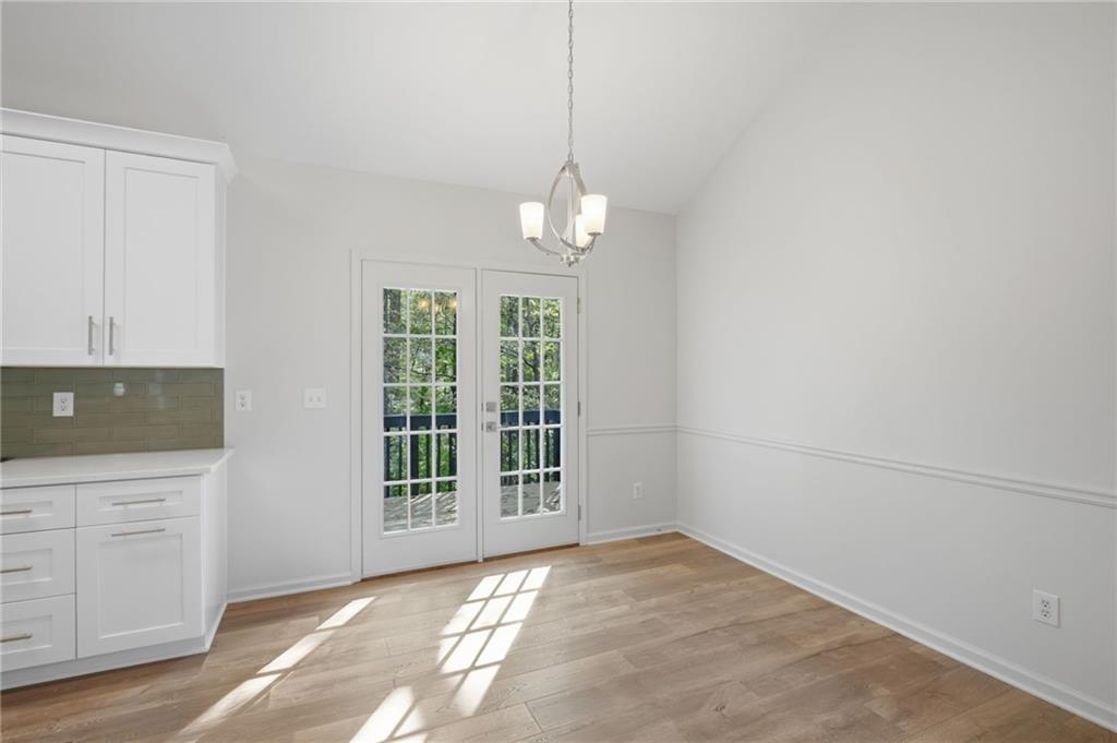 9485 Waldrip Road Gainesville, GA 30506 - Photo 11 of 30 an empty room with windows and cabinet