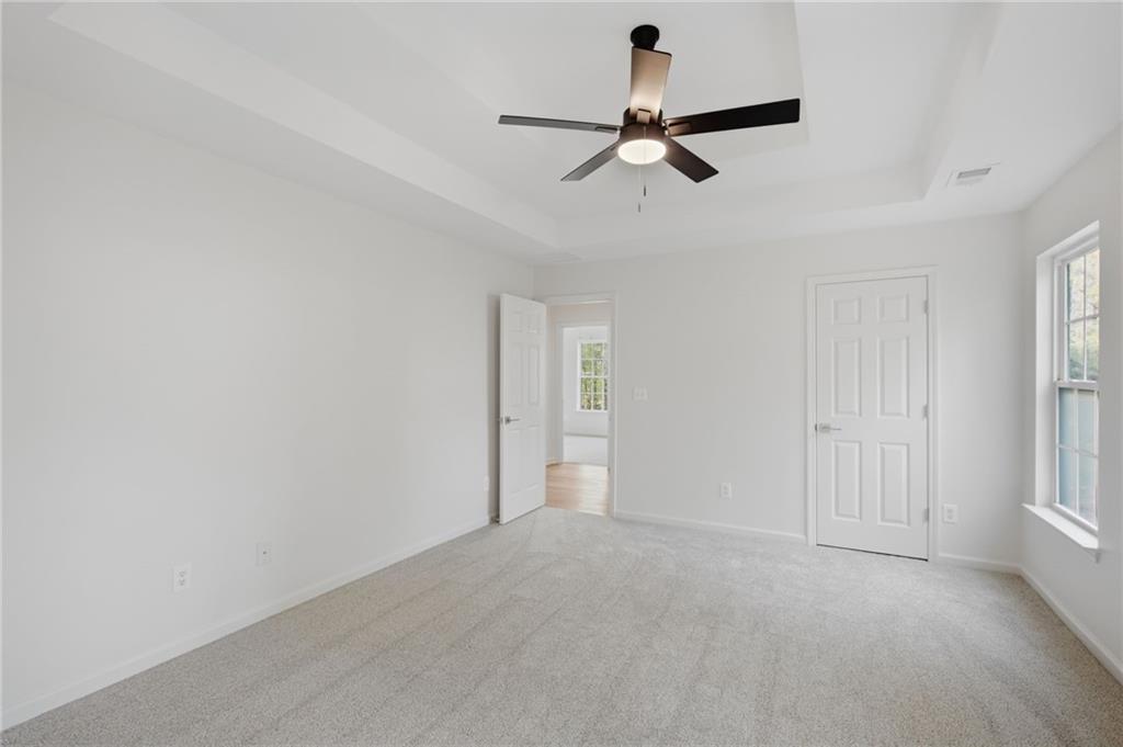 9485 Waldrip Road Gainesville, GA 30506 - Photo 12 of 30 a view of a livingroom with a ceiling fan and window