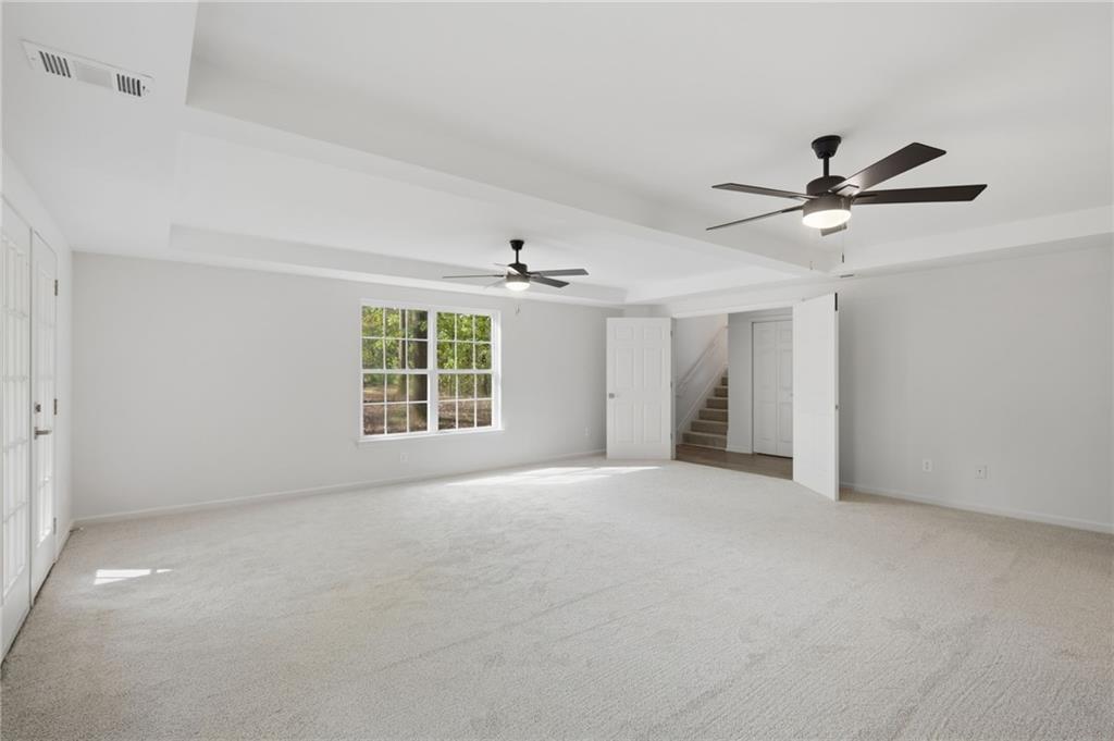 9485 Waldrip Road Gainesville, GA 30506 - Photo 20 of 30 a view of a livingroom with a ceiling fan and window