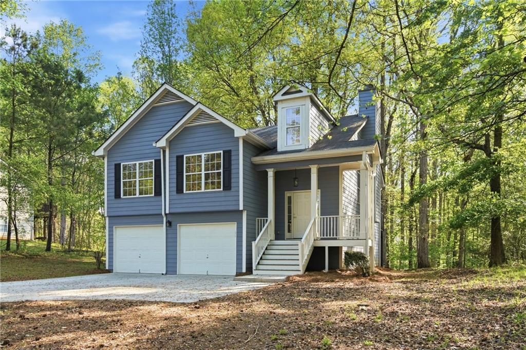 9485 Waldrip Road Gainesville, GA 30506 - Photo 2 of 30 a front view of a house with a garden
