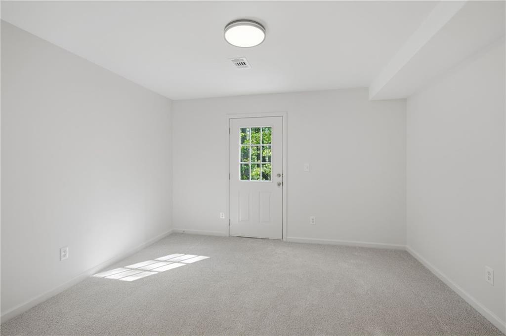 9485 Waldrip Road Gainesville, GA 30506 - Photo 21 of 30 an empty room with a window