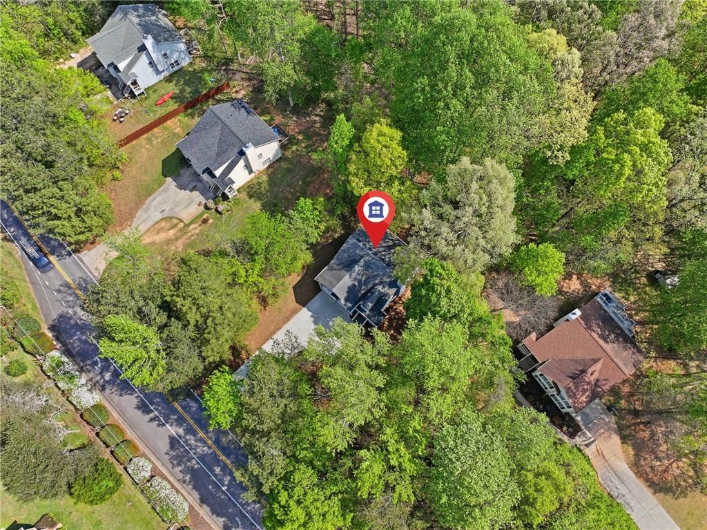 9485 Waldrip Road Gainesville, GA 30506 - Photo 29 of 30 an aerial view of residential house with outdoor space and trees all around