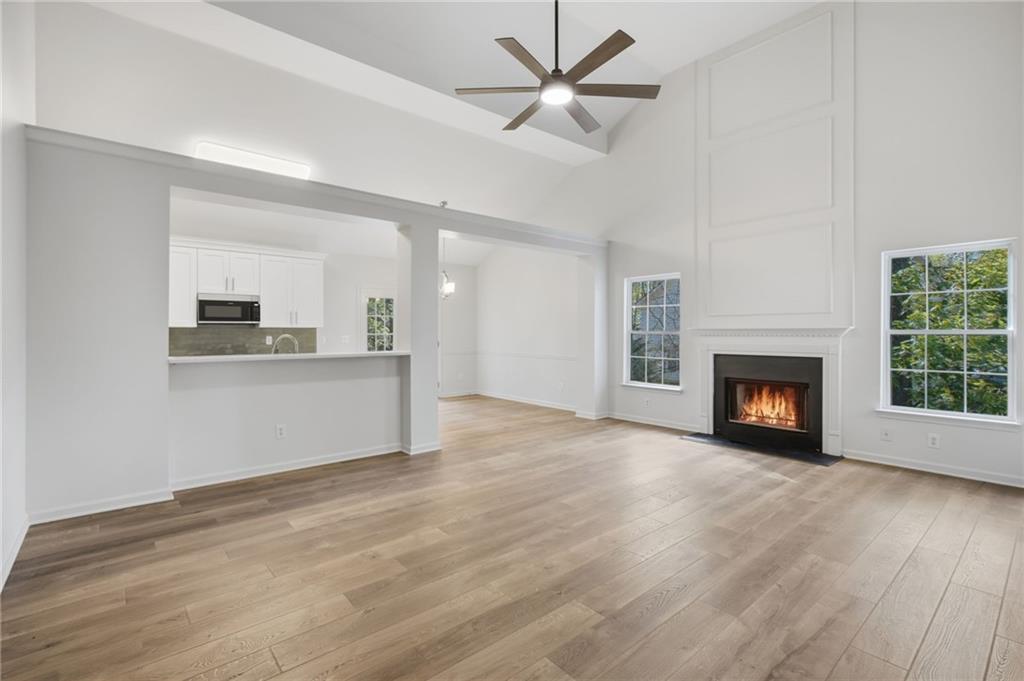 9485 Waldrip Road Gainesville, GA 30506 - Photo 7 of 30 a view of a room with kitchen and fireplace