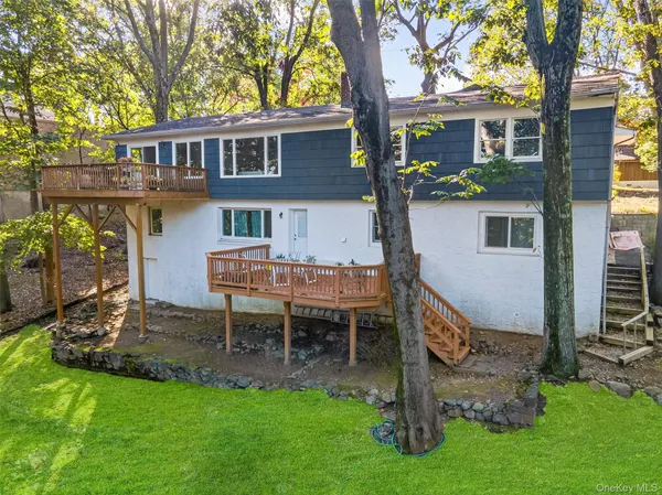 a view of a patio with table and chairs and potted plants