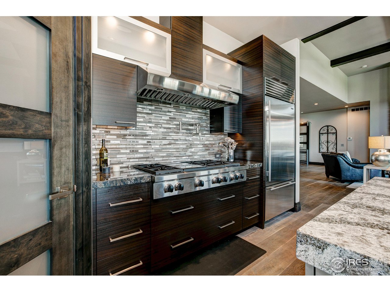 6438 Sanctuary Drive Windsor, CO 80550 - Photo 12 of 40 a kitchen that has a stove and a refrigerator