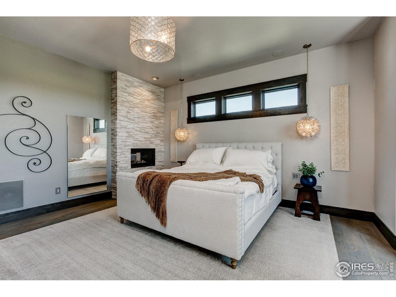 6438 Sanctuary Drive Windsor, CO 80550 - Photo 16 of 40 a bedroom with a bed and a window