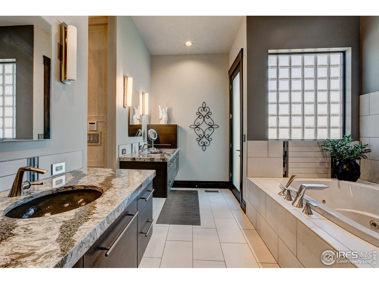 6438 Sanctuary Drive Windsor, CO 80550 - Photo 17 of 40 a kitchen with a sink stove and refrigerator