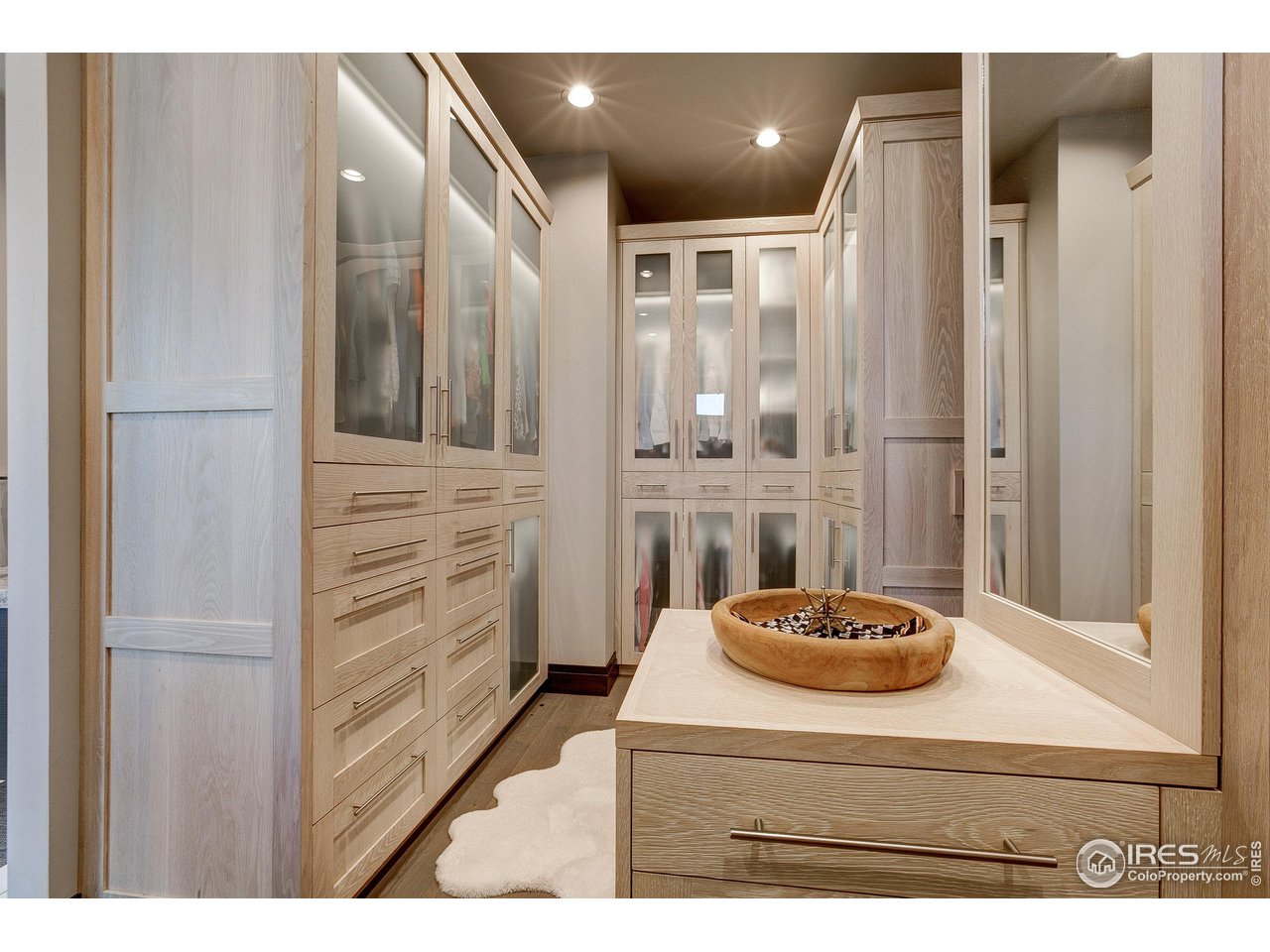 6438 Sanctuary Drive Windsor, CO 80550 - Photo 19 of 40 a bathroom with a sink and a mirror