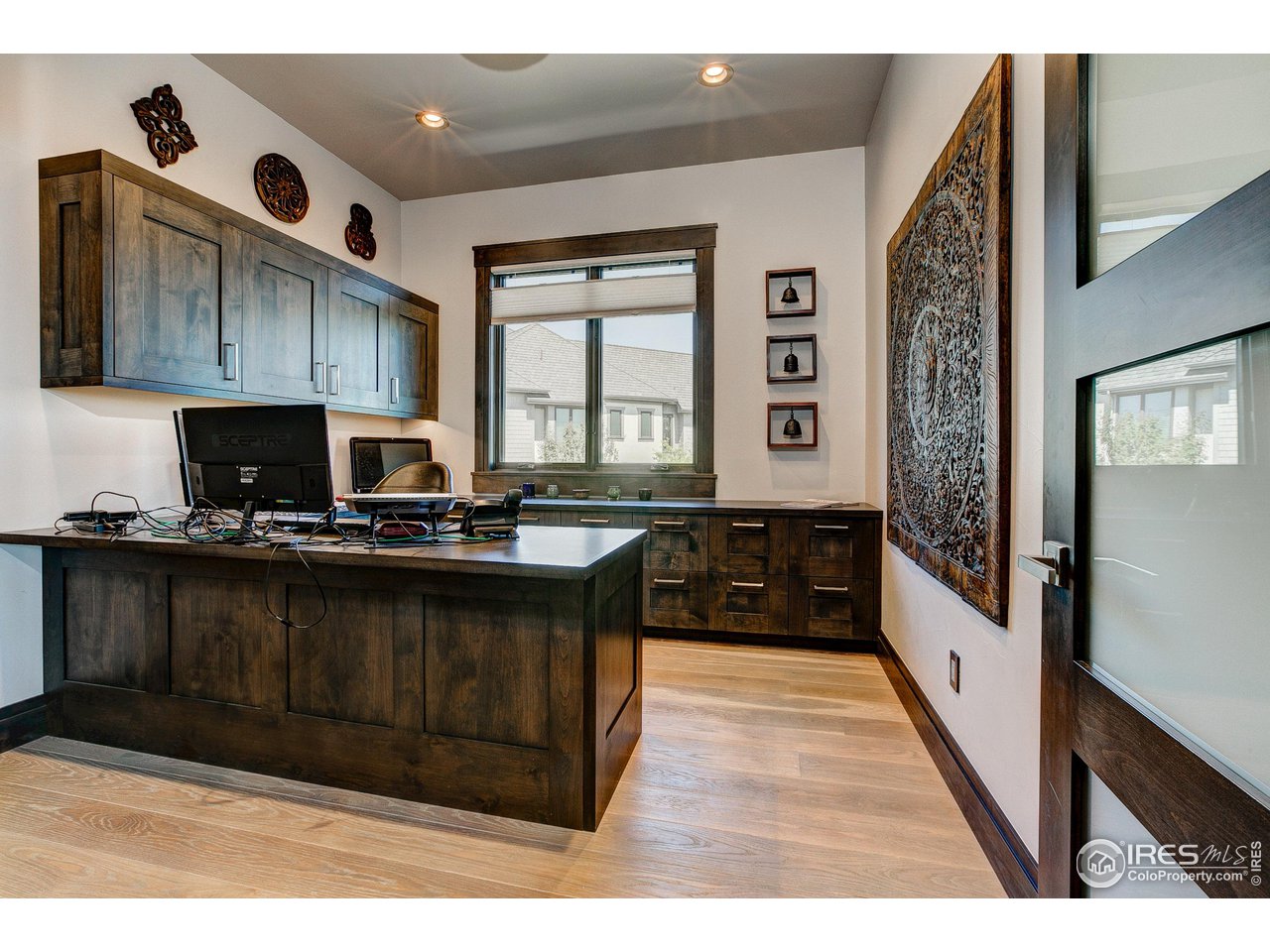 6438 Sanctuary Drive Windsor, CO 80550 - Photo 21 of 40 a kitchen with a sink and cabinets