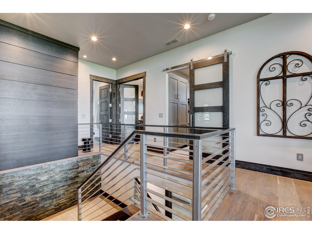 6438 Sanctuary Drive Windsor, CO 80550 - Photo 24 of 40 a view of living room filled with furniture and paintings on the wall