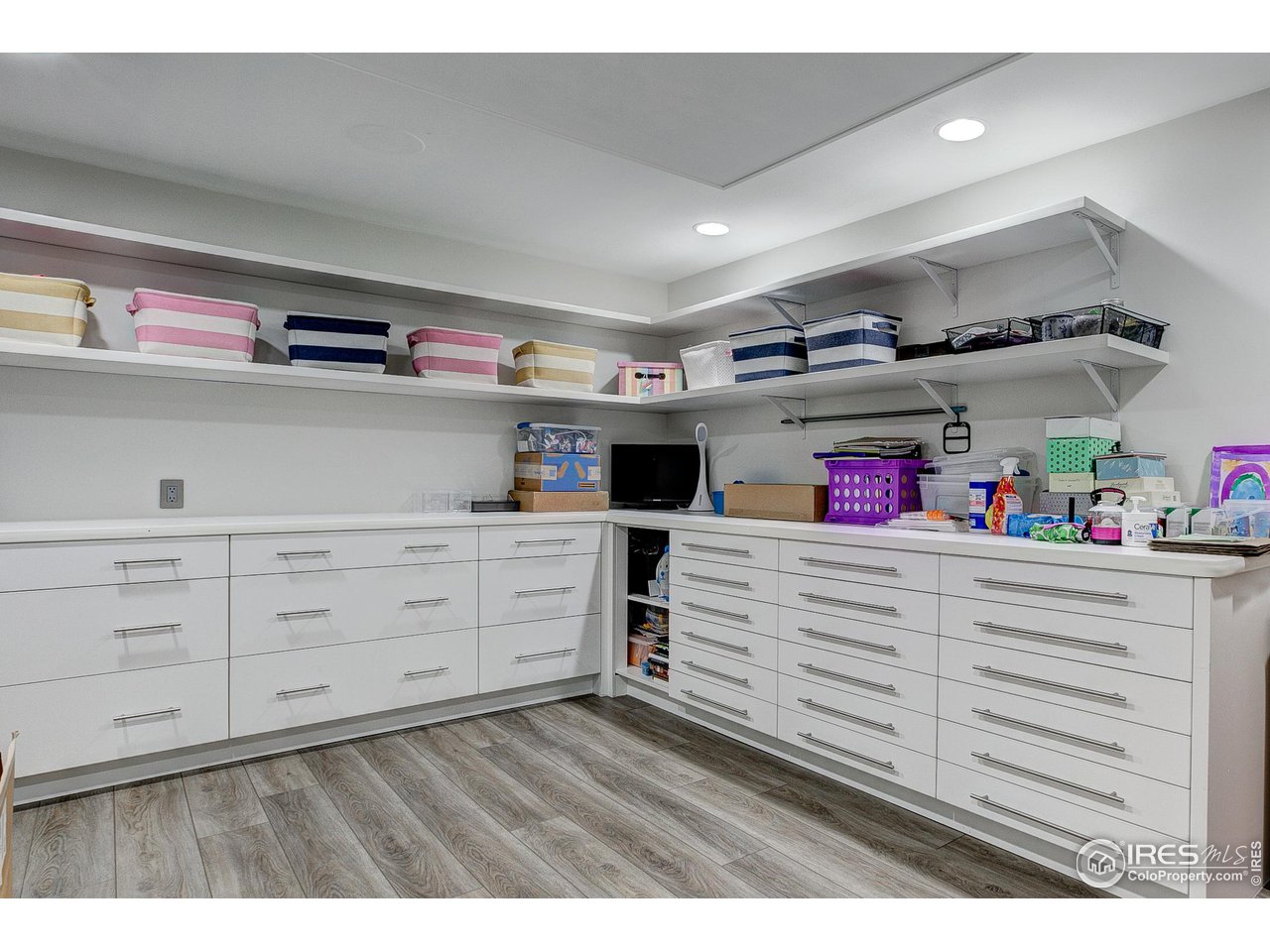6438 Sanctuary Drive Windsor, CO 80550 - Photo 29 of 40 a utility room with cabinets