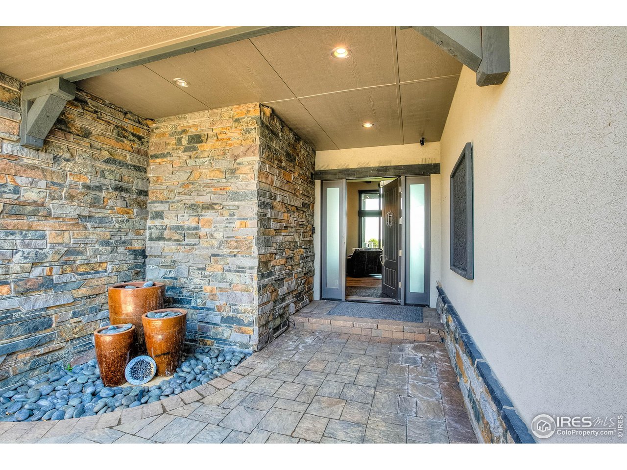 6438 Sanctuary Drive Windsor, CO 80550 - Photo 3 of 40 a view of empty room with wooden floor