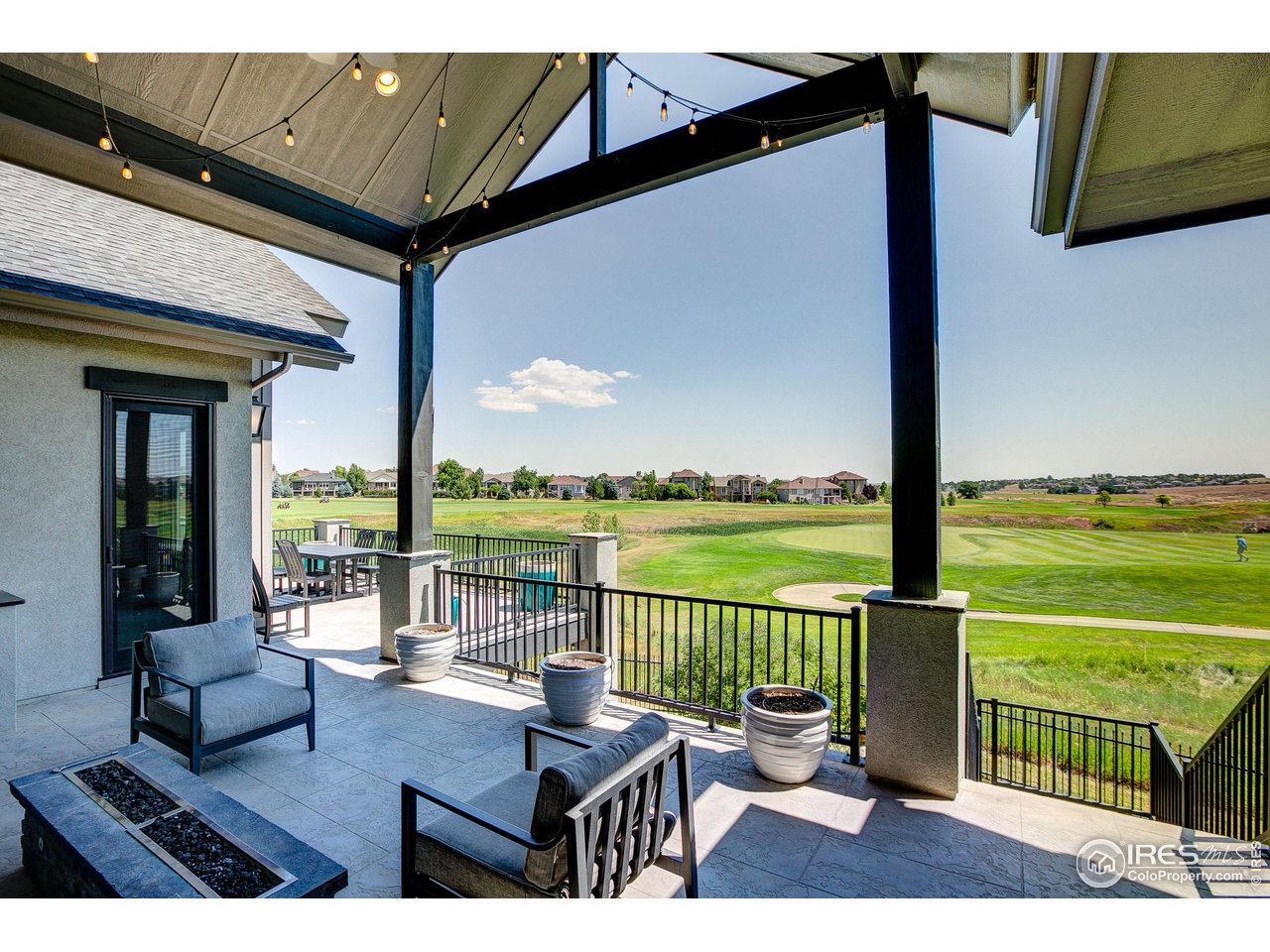 6438 Sanctuary Drive Windsor, CO 80550 - Photo 36 of 40 a view of a balcony with lake view and a potted plant
