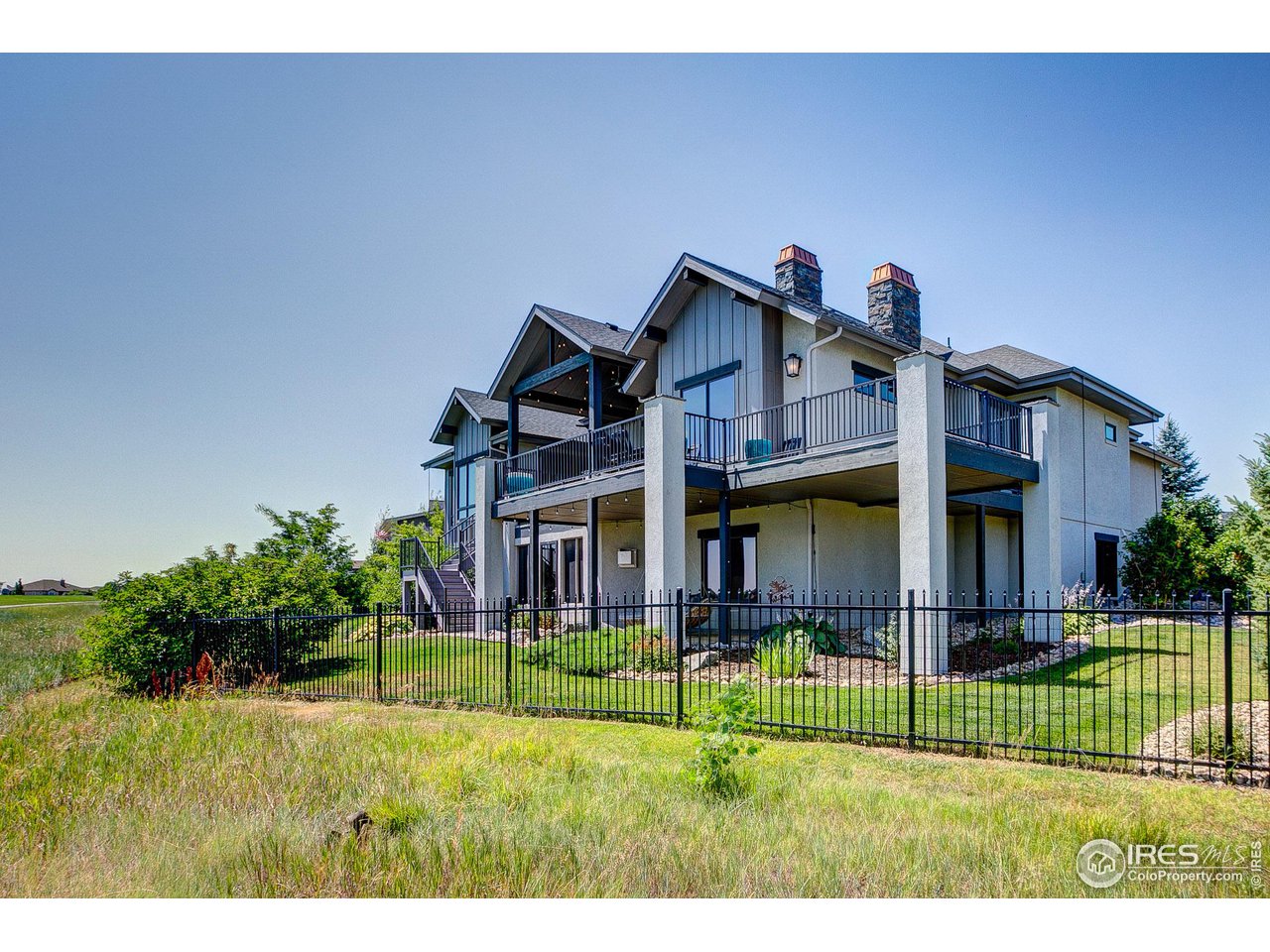 6438 Sanctuary Drive Windsor, CO 80550 - Photo 39 of 40 a front view of a house with a yard