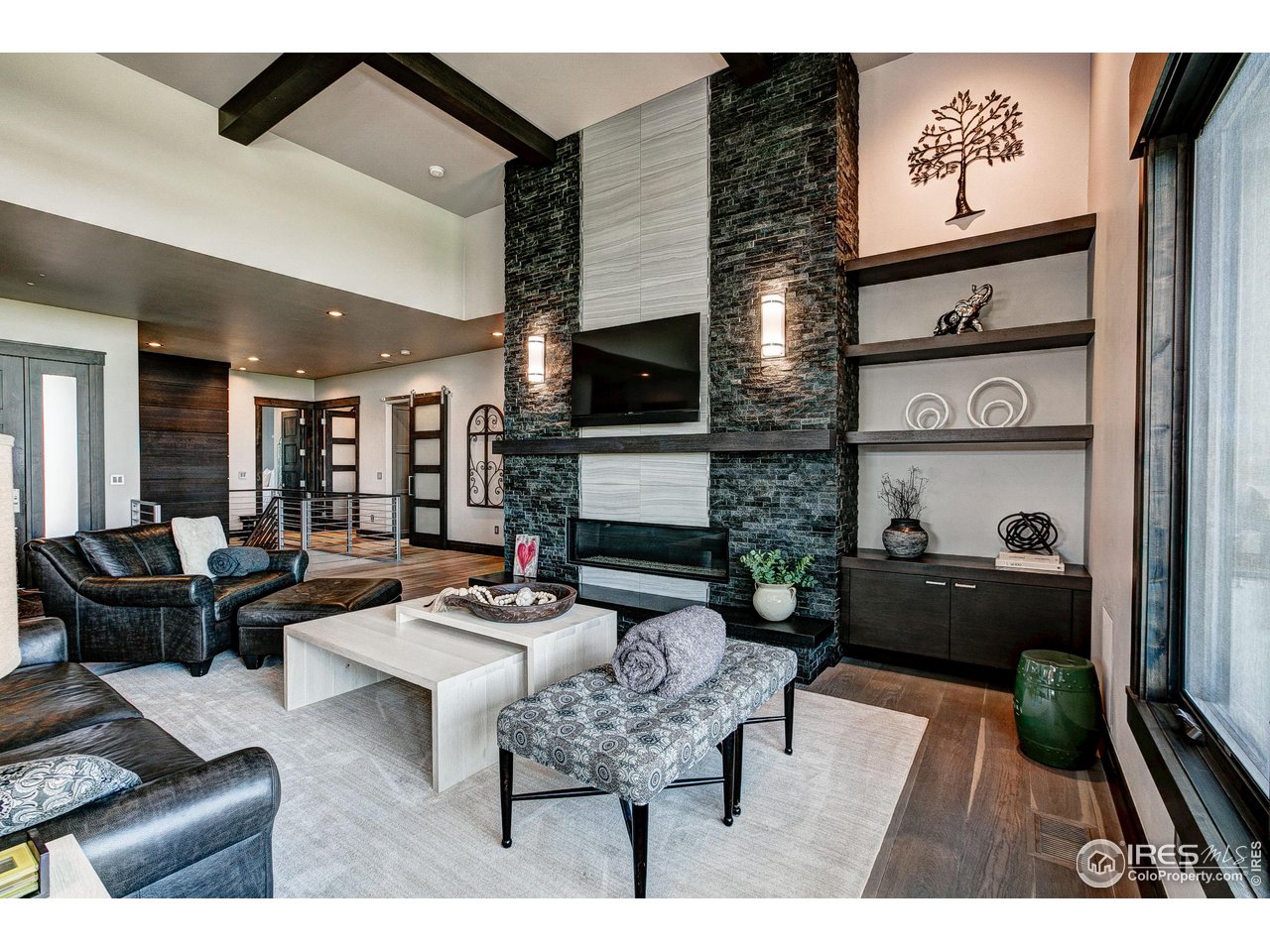 6438 Sanctuary Drive Windsor, CO 80550 - Photo 6 of 40 a living room with furniture and a flat screen tv
