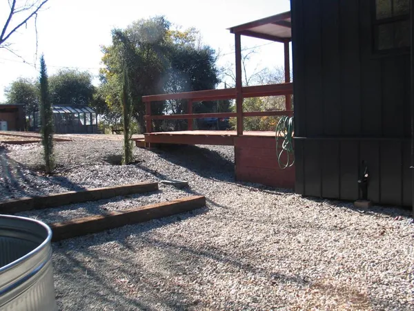 a view of a backyard of the house